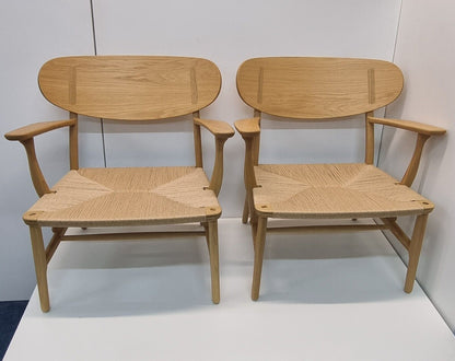 Set of 2 Carl Hansen CH22 Lounge Chairs Finished In Oak With Natural Papercord Seats